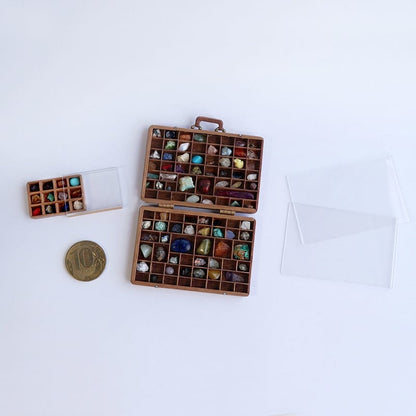 Collection Of Stones In A Suitcase